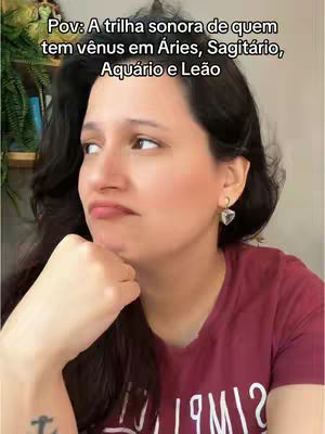 A woman with dark hair is shown from the chest up, gazing to the left with a thoughtful expression. Text overlays the image. The background is a softly blurred interior with a suggestion of shelves and greenery.