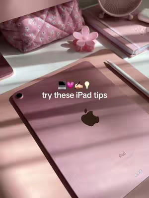 The cover image showcases a light pink aesthetic with the focus on an iPad placed on a matching surface. A stylus rests beside the iPad. The background features other items like a pink floral accessory, a small fan, and a quilted makeup bag. The overall composition is visually soft and coordinated.