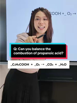 A woman is standing in front of a whiteboard, pointing towards it with a pen. The board displays a chemistry equation with text overlays asking the viewer to balance the combustion of propanoic acid.