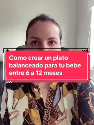 A woman is centered in the frame, with a red rectangular text box overlaying her upper chest. She has brown hair and is looking at the camera. She wears a patterned shirt with a mix of black, tan, and off-white colors. The background is a light, neutral shade.