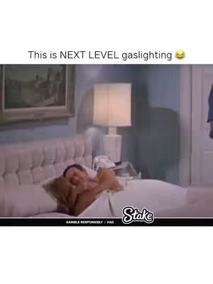 The image shows a man in a bed, seemingly asleep or waking up, with text overlayed across the top. The scene is set in a bedroom with a large bed, a lamp, and a painting on the wall, with a logo at the bottom.