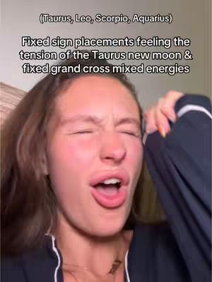 The cover image shows a close-up of a young woman's face, mid-expression, with her mouth open and eyes squinted as if in frustration or strong emotion. Text overlays at the top indicate astrological contexts related to Taurus, Leo, Scorpio, and Aquarius, and a second line below details sign placements feeling tension. The woman's skin tone is fair, and her brown hair is styled in loose waves. Her outfit is partially visible, suggesting a dark-colored top. The overall lighting appears natural, conveying a sense of emotional intensity relating to the astrological information presented.