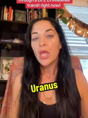 A woman with long black hair and light skin is speaking directly into the camera. The background includes a partially visible bookshelf and some decorative items. The primary color scheme is neutral, with the woman's skin tone and dark hair creating contrast. A yellow text overlay that reads "Uranus" is positioned at the bottom-center of the image.