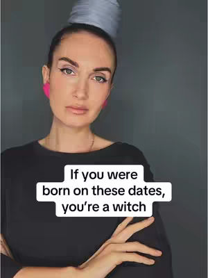 A woman with dark hair pulled up, wearing a black top and pink earrings, looks directly at the camera. A text overlay in a white box states, "If you were born on these dates, you're a witch."