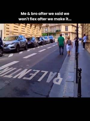 The image shows a street scene with parked cars on the left, and a couple walking down a sidewalk on the right. Text is overlaid at the top, and the road features white painted text.