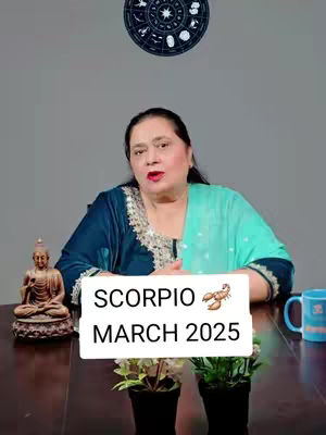 A woman sits behind a table with a zodiac wheel and a statue of Buddha in the background. A sign with text over the image.