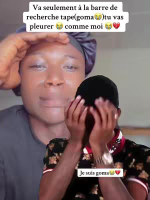 The image shows a person in the background looking up with their hand to their forehead. In the foreground, a person covers their face in a hand-over-mouth gesture while appearing to cry. Text overlays are in white on the top. The background character is wearing a satin bonnet, and the foreground person is wearing a printed shirt.