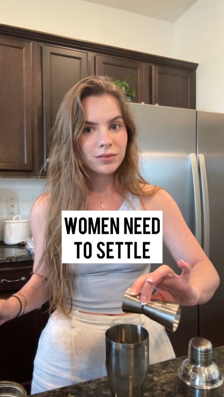 A woman in a kitchen setting, holding a cocktail shaker and measuring tool. There is a text overlay that reads 'WOMEN NEED TO SETTLE'.