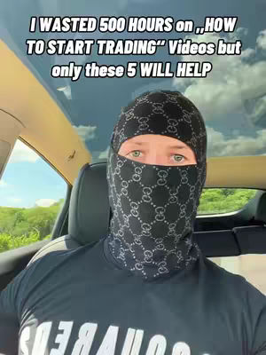 A man in a patterned balaclava and a black t-shirt is seated in the driver's seat of a car. Text overlayed on the image reads "I WASTED 500 HOURS on 'HOW TO START TRADING' Videos but only these 5 WILL HELP". The background features a sky and some greenery, suggesting an outdoor setting.