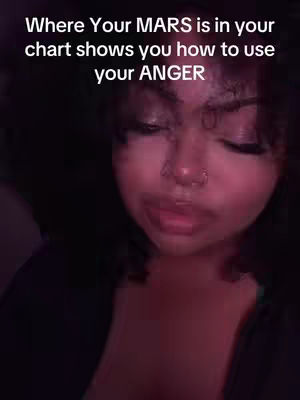 The cover image shows a close-up of a person, likely female, with visible facial features: dark hair, dark eyebrows, and a nose ring. The skin tone appears to be medium. The image has a soft, slightly blurred look. Text overlay indicates a focus on astrology, mars, and anger.