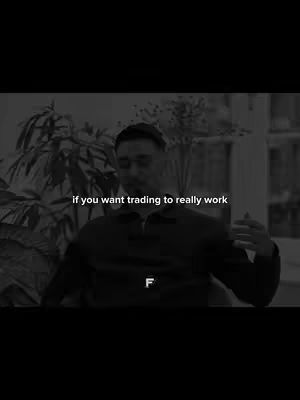 The cover image is a black and white video still featuring a man seated indoors. The man, with short hair and glasses, is gesturing with his hands while speaking. Behind him is a blurred indoor setting with greenery and possibly window light, creating a soft backdrop. The text overlay in the image reads, 'if you want trading to really work'.