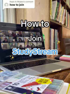 A laptop displaying a video call interface is the central focus, with multiple faces visible on the screen. Below the laptop, there are some colored pens and a paper, and to the top left we can read a comment 'how to join'. The background includes a bookshelf and wooden textures, and the image uses a warm, natural color palette with some bright highlights.