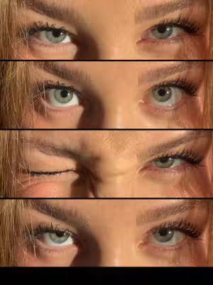 The cover image is a close-up view of a person's eyes, divided into four horizontal sections. Each section displays the same eyes but with subtle variations in expression. The eyes are light-colored, possibly green or gray, and the eyelashes are visible. The skin tone appears fair with some visible texture. The background is a warm, golden tone, suggesting a natural light source. The layout is simple, focusing entirely on the eyes and the changing expressions across the different sections.