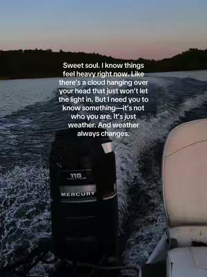 The image shows a scenic view from a boat with text overlay. The perspective looks over the black engine towards the water and the setting sun, with a boat seat on the right. The text overlay contains an encouraging message.