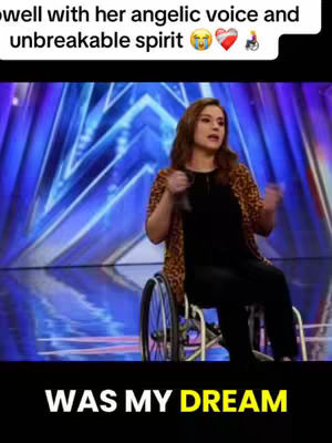 The image shows a woman in a wheelchair on a stage with a sparkling blue background. She is holding a microphone and has a focused expression. Text overlays at the top read, '… angelic voice and unbreakable spirit.' At the bottom, text reads, 'WAS MY DREAM' in yellow.