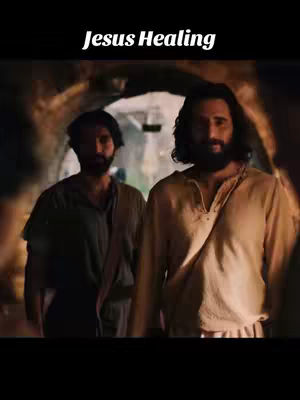 The cover image shows two men walking forward in a dimly lit, stone-walled setting. The man in the foreground is dressed in light-colored clothing, while the man behind him appears to be in darker attire. The text overlay "Jesus Healing" appears in bold, white font at the top of the image.