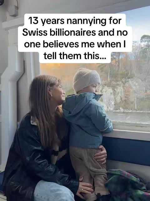 A woman and a young child are inside of a train or bus, looking out of the window at a scenic view. The woman is wearing a black jacket and the child is wearing a warm hat. The hook text is a white rectangle in the image's top.