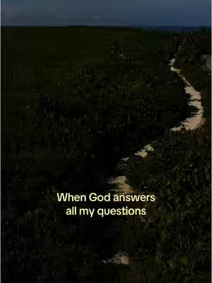 A dark, vertical image featuring a landscape with rolling hills and a winding stream or path cutting through it from top to bottom. The sky appears overcast. Text overlayed at the bottom reads, 'When God answers all my questions'.