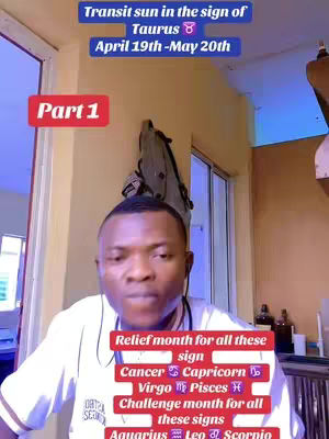 A man in a white shirt is centered in the frame, appearing to film with a phone or camera. Above him, text in a blue rectangle reads 'Transit sun in the sign of Taurus' paired with the Taurus symbol and the dates April 19th - May 20th.  Below, a red rectangle labeled 'Part 1' suggests a series.  The background shows a yellowish wall, a window, and elements of an interior space.