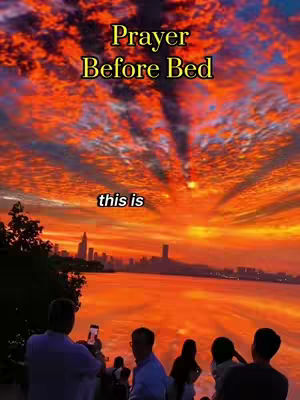 The cover image captures a breathtaking sunset over a cityscape and water. An orange and red gradient sky dominates the backdrop, with silhouettes of buildings along the horizon and their reflections in the water below. Several people are gathered in the foreground with the back of the men in focus who watch the sunset with their smartphones in hand. Above the scene at the top, there's a text overlay in a golden color.