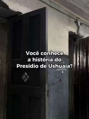 The image shows a close-up of a dark wooden door slightly ajar, set in a dimly lit interior suggesting an old building or prison. White text overlays the image at the center, posing a question.