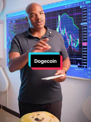 A man in a grey polo shirt stands in front of a screen displaying a stock chart, holding a tablet. Overlayed in the center is a rectangular box with the word "Dogecoin". Below, a cartoon likeness of a dogecoin character is placed in front of the person, sitting on a table..