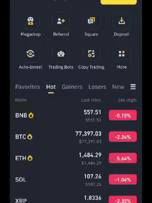A dark-themed screenshot of the Binance app. The screen displays a range of cryptocurrency information, with metrics like price changes and market data. The layout includes a menu at the top with several options, and the rest of the view shows the details of various cryptocurrencies.