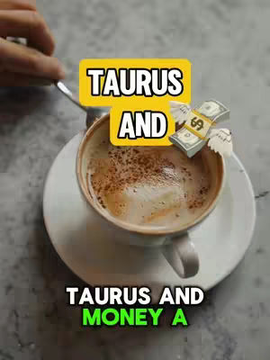 A top-down shot features a cup of coffee on a saucer, with a yellow banner reading 'TAURUS AND' overlaying the cup. A bundle of dollar bills with wings is positioned to the right of the banner. Below the cup, text in green says 'TAURUS AND MONEY A'. The background has a muted, light color palette.