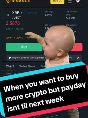 The cover image shows a screenshot of a Binance crypto trading interface, overlaid with a cartoon baby reaching out. The Binance interface displays information about XRP/USDT, including its current price and trading data. The baby is positioned over the interface with its arm extended toward the 'Buy' button. Near the bottom is a text overlay with the question: 'When you want to buy more crypto but payday isn't til next week.'