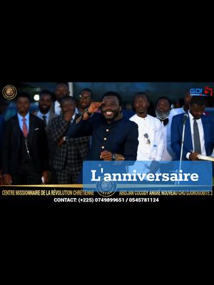 The image shows a man in a suit saluting with a group of men. Text overlays include "L'anniversaire" and contact information.