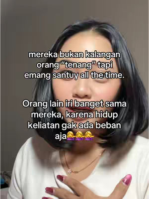 A woman with dark hair and makeup looks directly at the viewer with text overlays in the image. The text is in Indonesian.