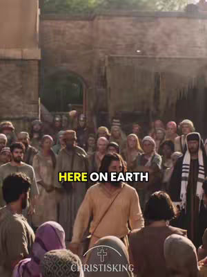 A crowd of people, many in neutral-toned garments, gathered in an outdoor setting. The central figure, presumed to be a biblical character, is in the foreground, bathed in sunlight. An overlaid text bubble saying "HERE ON EARTH" is present.