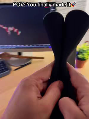 The cover image shows a first-person point of view. The hands are holding a black object forming a heart in front of the camera, and a computer monitor can be seen in the background with a graph. A keyboard and some items are on the table.