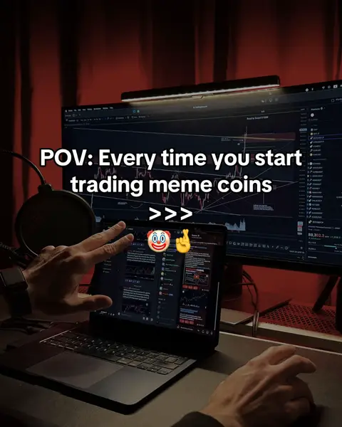 A person is at a desk with a computer and a laptop open in front of them, and a microphone to the side. The laptop has a graph up on the screen. The image is in tones of red, and the text reads 'POV: Every time you start trading meme coins' with emojis below.