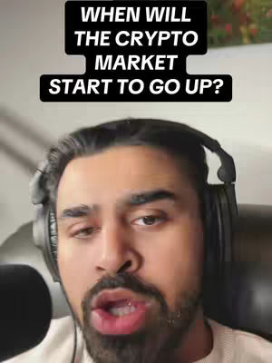 The cover image features a man with dark hair and a beard, wearing headphones. He is positioned from the chest up, looking directly at the camera with an open mouth as if speaking. Above him, a black rectangle contains white text posing a question about the crypto market. The background is a blurred, undetailed interior.