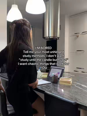 A woman stands in a kitchen setting, viewed from behind, with her back to the camera. She is wearing a black outfit and leaning against a countertop, in front of which is a laptop and some books. Above her are two overhead lights and a vent hood. Text overlaying the image asks for study methods.