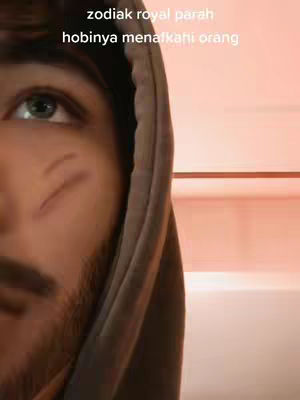 A close-up shot features the right eye and part of the face of a man. He has a beard and is wearing a hooded sweatshirt. Overlayed text is visible at the top.