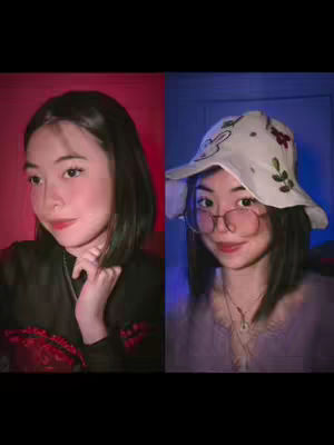 The cover image is split into two halves, each showcasing a different side of a young woman. On the left, a woman with dark hair, a black top, and red surroundings. On the right, the same woman in a floral hat, and glasses set against a blue backdrop. The composition uses a split-screen technique with contrasting backgrounds and attire to emphasize different aspects or moods.