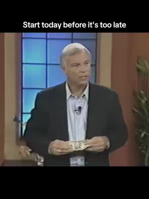 A man dressed in a dark blazer and light blue shirt stands in front of a blurred background that appears to be a stage setting. He holds up a dollar bill in his hands. Above the man is text that says: Start today before it's too late.