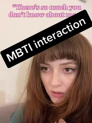 The cover image shows a close-up of a woman's face with long, auburn hair, bangs, and a questioning expression. A black banner with white text that reads "MBTI interaction" is diagonally across the top of her forehead. Above this is a light pink text overlay that says ,"There's so much you don't know about me". The overall composition is focused, with the person taking up most of the frame; the background is a blurred beige color.