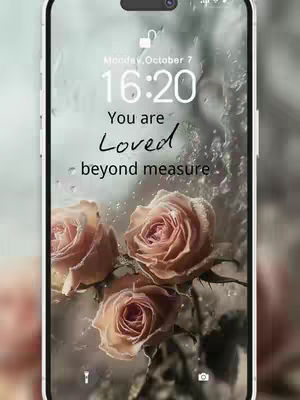 The image shows a close-up of a smartphone screen displaying what appears to be a floral lockscreen image with inspirational text. The background has a blurred effect as if there is water on the screen. The foreground has three roses in a light pink color.