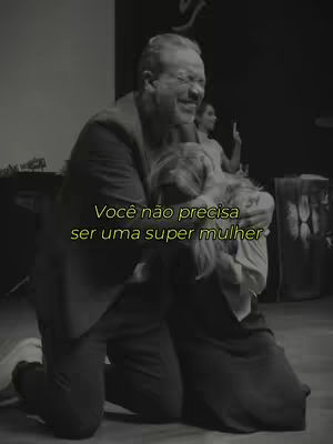 A black and white image shows a man embracing a woman, both appearing emotional. Text is overlaid in yellow.