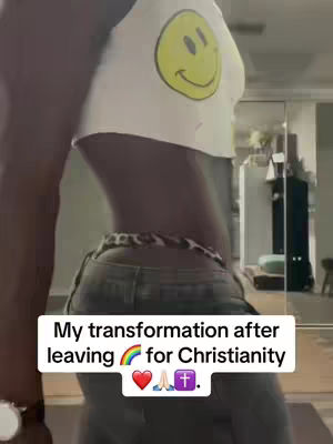 A person from the side flexing their stomach and wearing a white Smiley Face crop top and a pair of jeans. Overlaid text indicates the transformation is related to Christianity.