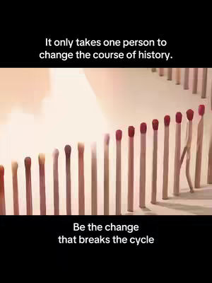 An image with a black upper and lower section, and a slightly blurred, cream-colored middle section. It features a line of matchsticks, transitioning in color from light to dark brown, until one sticks out. The first text overlay displays a white font and states, 'It only takes one person to change the course of history.' The second text overlay, also in white, says, 'Be the change that breaks the cycle.'