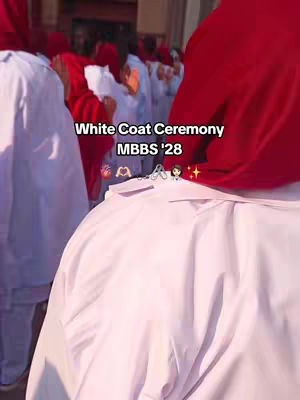 A group of people dressed in white coats and red head coverings are gathered outdoors. The focus is on two close-ups: one on the back of a person in a white coat and red hood, and another of a person in a white coat and part of a red hood. The composition has a vertical layout with the subjects in the frame.