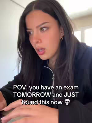 A young woman with long dark hair is looking at something off-screen with a surprised expression. Text overlay on the image says, 'POV: you have an exam TOMORROW and JUST found this now,' with a skull emoji. The lighting is natural.