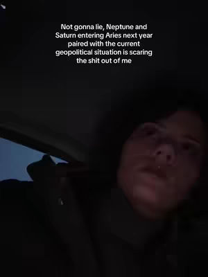 The video cover shows a close-up of a person's face, lit with natural light from an unseen source. Dark shadows contrast with the person's face, accentuating the eyes and high cheekbones. The person is looking up with a slight upward angle. Overlayed text explains a astrological event.