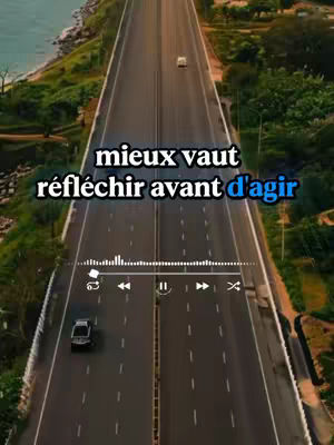 An aerial view of a highway, with text overlayed in the center. The highway has two lanes in each direction, and a car is driving on the right-hand side. The text says, "mieux vaut réfléchir avant d'agir." The road is surrounded by nature, with hints of blue sky and green plants on the sides.