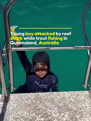 The cover image shows a young boy partially submerged in teal-green water, framed by metallic boat rails. He's wearing a black swim cap, and a navy blue shirt. The text overlay features an attention-grabbing headline. The overall composition conveys a sense of urgency and news.