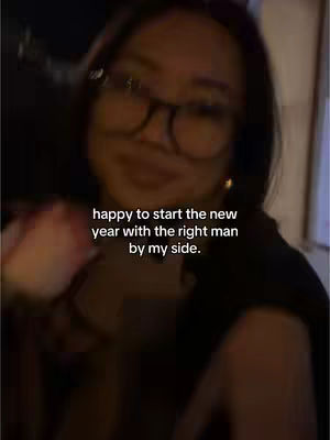A blurry selfie showing a woman wearing glasses, and the focus is on her smiling face. Text overlaid on the image expresses positive sentiments.